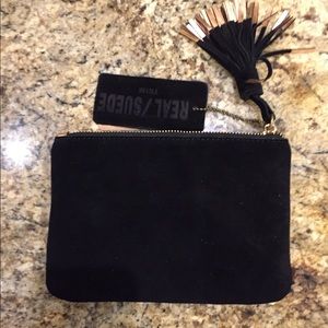 Black suede leather and gold hand bag